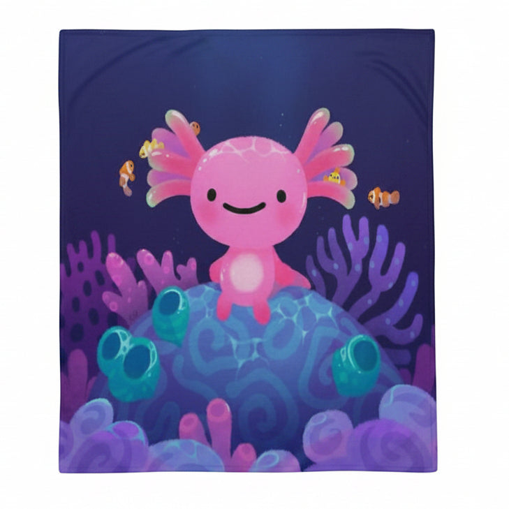 A blanket with a pink axolotl design on a dark blue background