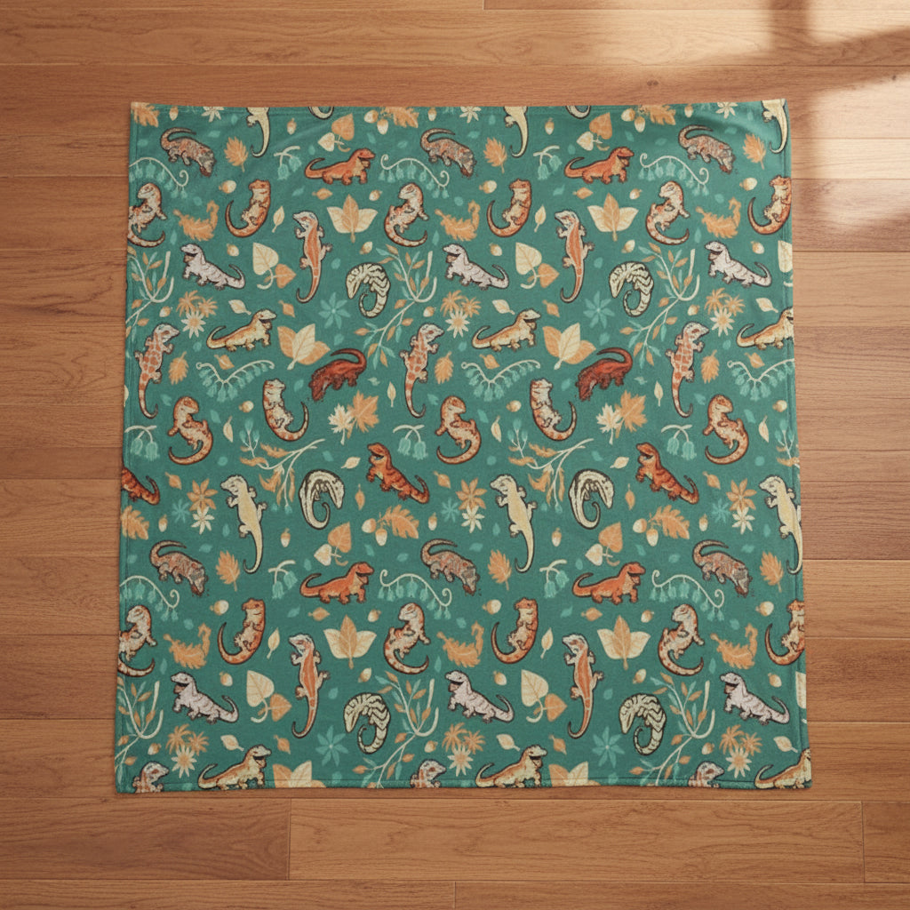 teal blanket with autumn leaves and geckos
