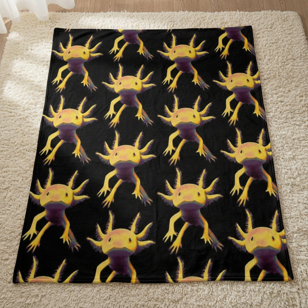 A black blanket with an axolotl pattern