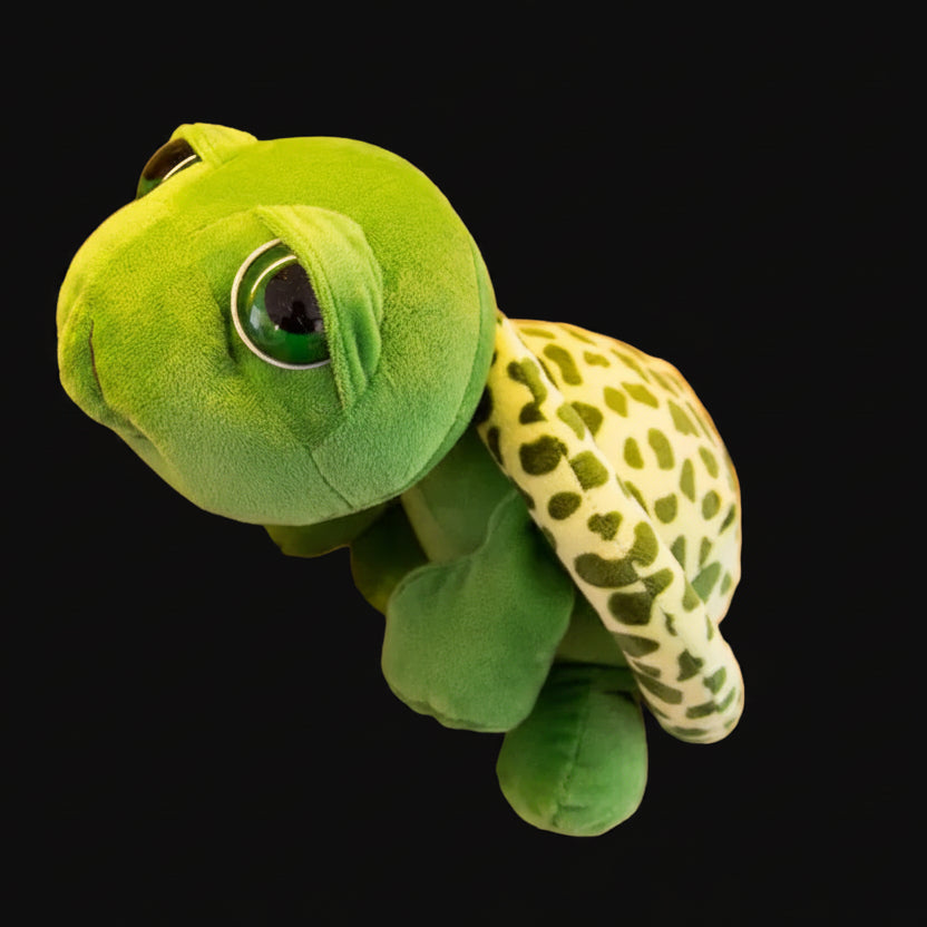 Green plush toy resembling a turtle 