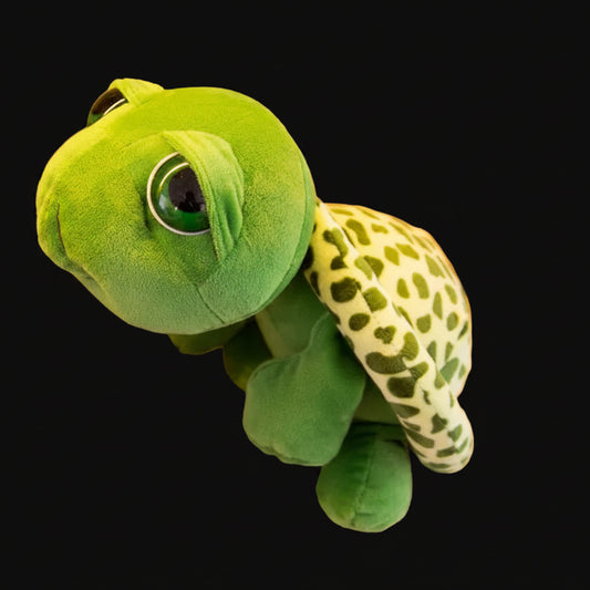 Green plush toy resembling a turtle 