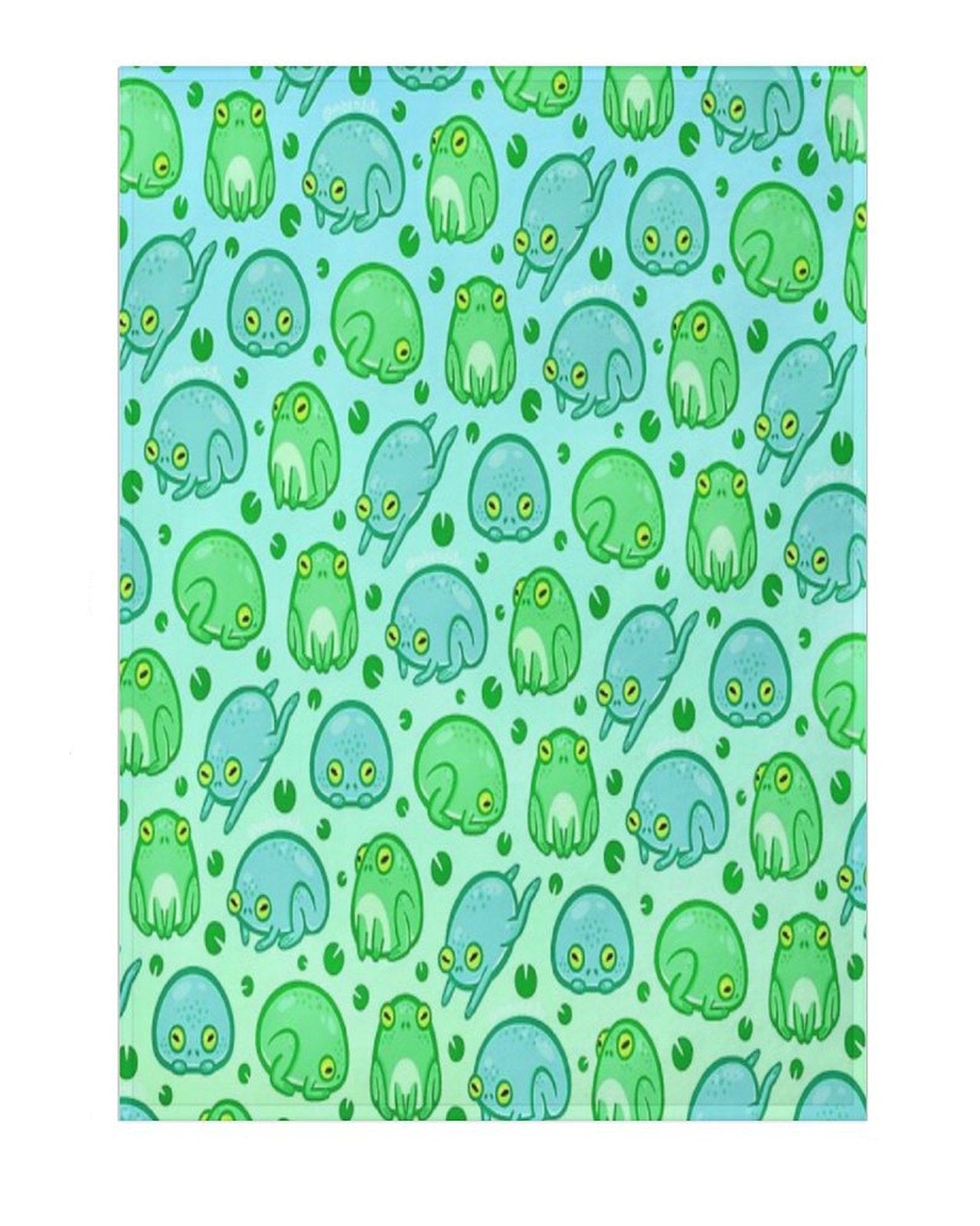 A blanket with a pattern of green and blue frogs on a blue background