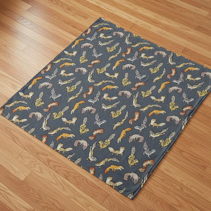 gray blanket with leopard gecko pattern