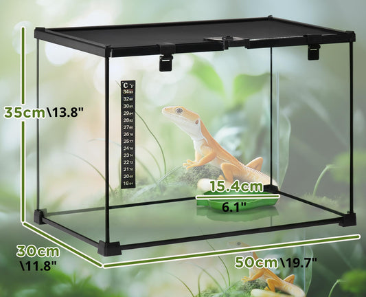 Black plastic reptile terrarium with a glass front panel, shown with overlaid dimensions (35cm height, 30cm width, 50cm depth) and a small gecko inside on a mossy substrate against a blurred green background.