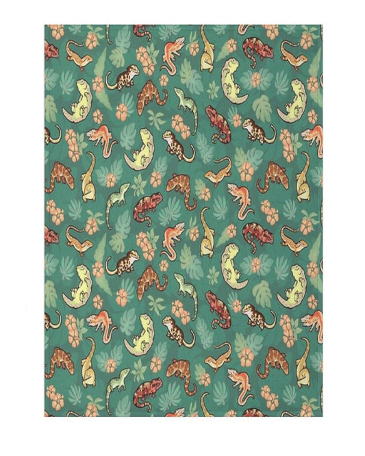a teal green blanket with a pattern of new caledonian geckos and tropical flowers