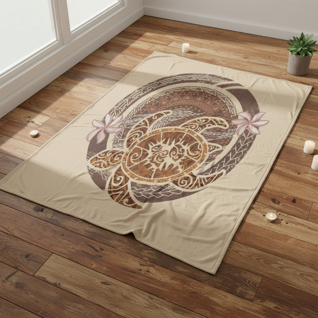 a beige blanket with a decorative turtle design on a white background