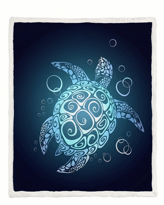 A square throw blanket with a white fringed border, featuring a central graphic of a sea turtle swimming underwater in shades of light blue, cyan, and white against a dark navy blue background.