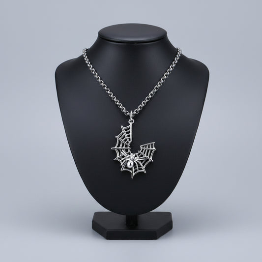 Silver spider web pendant on a chain